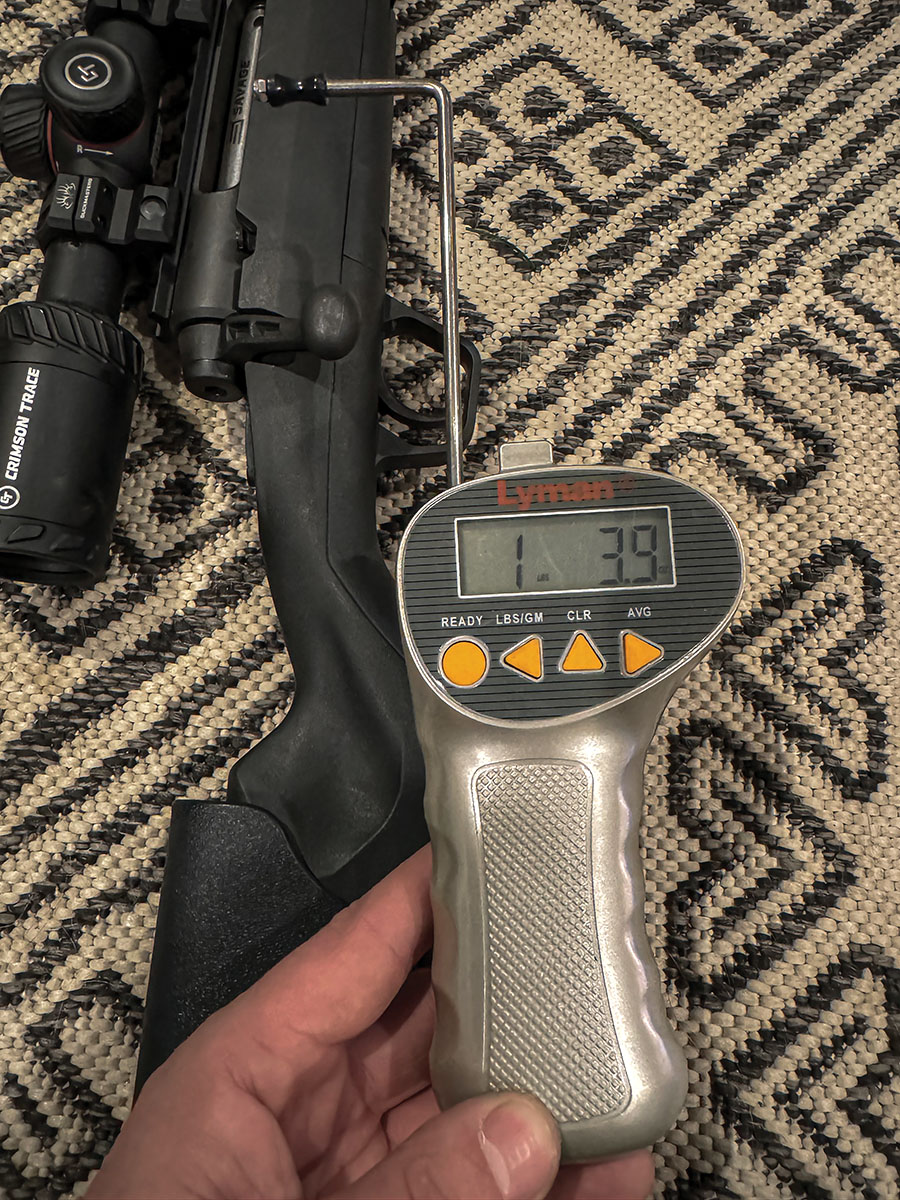 Savage Axis showing the trigger weight after spring swap with a Lyman Electronic Digital Trigger Pull Gauge. Trigger breaks cleanly at 1 pound 3.9 oz.
